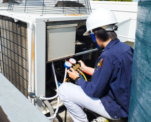 hvac technician setting up office automated climate control